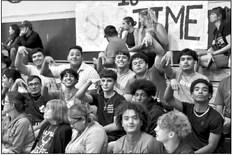 Multiple members of the Alpine Fightin’ Buck football team cheer on the Lady Buck volleyball team in their game against 6A Odessa Permian. Photo by Felipe Fierro
