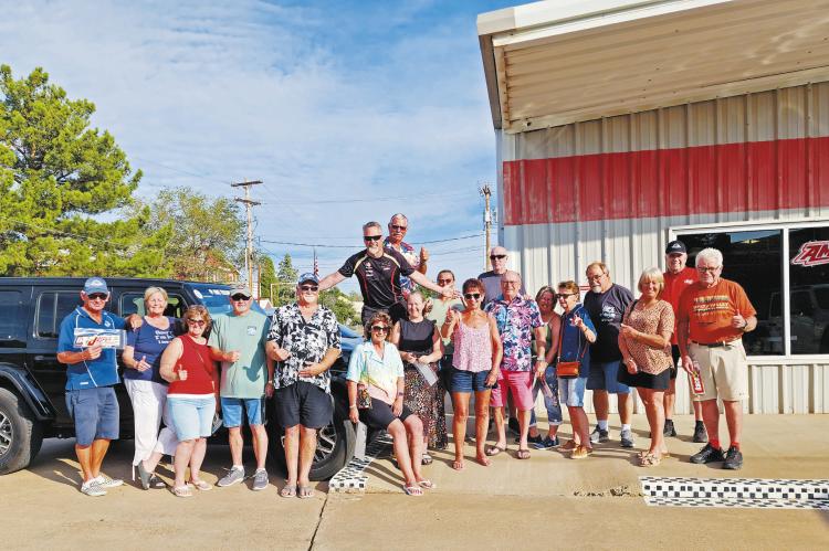This group of car enthusiasts from Australia and New Zealand spent some time at The Stable to take a look at some of the classic and newer-model sports cars on display Monday morning. The tour group, Kiwis On Tour NZ, will be visiting eight cities in Texas, including Alpine, along with several others in Utah, Arizona, New Mexico, and California. Photo by Kara Gerbert