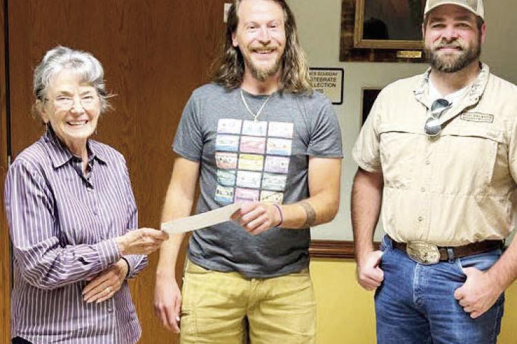 Jesse Ellgren (center) receives a scholarship check from Chihuahuan Desert Research Institute Director Emeritus Shirley Powell (left). He is also pictured here with Big Game Specialist Dr. Justin French of the Borderlands Research Institute. Photo courtesy of CDRI