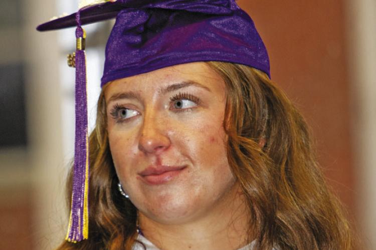 Not only is Kody Hawkins an outstanding athlete, but she’s also tops in academia, as shown here with her National Honor Society shawl and her multiple honor cords. Photo by Kara Gerbert
