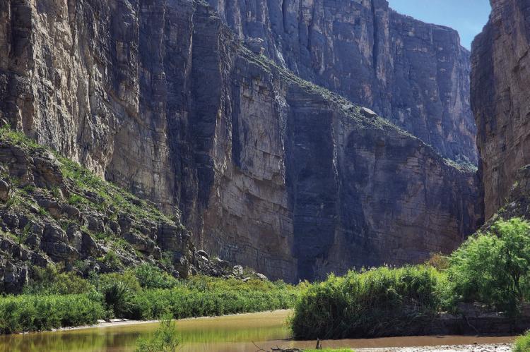 The 1500-foot canyon walls that announce Santa Elena Canyon in Big Bend National Park stand silent on Sunday, August 16, except for the ripple of water across rocks in the riverbed of the Rio Grande. From the path of destruction seen from the parking lot at Santa Elena to the Cottonwood Campground turnoff, silence was not the case earlier in the week. Photo by Kara Gerbert
