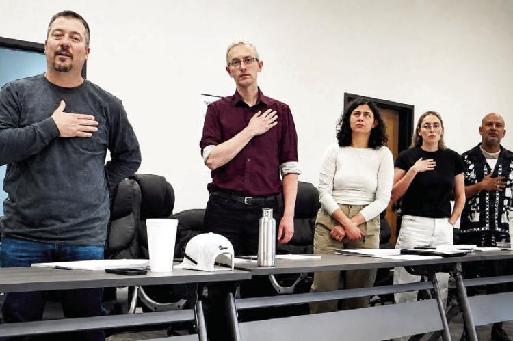 The Marfa City Council stands for the Pledge of Allegiance during last Thursday’s regular meeting. From left are Mayor Pro-Tem Mark Cash, Councilor Travis Acreman, Councilor Emily Kolb, Councilor Katy Kowal, and Councilor Raul Lara. Avalanche photo