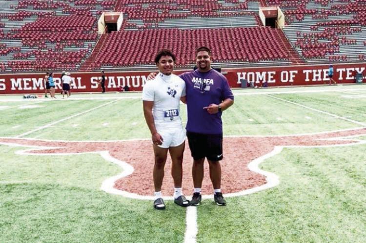 Marfa junior shot-put State qualifier Ayden Alvarez stands inside the Darrel K. Royal-Texas Memorial Stadium on the campus of UT Austin with his track coach, Kevin Pippen. Courtesy photo