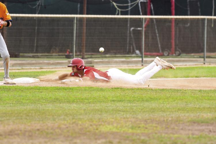 Nathan Mix slides into third to beat the tag at Kokernot Field. Photo by Julie Myers