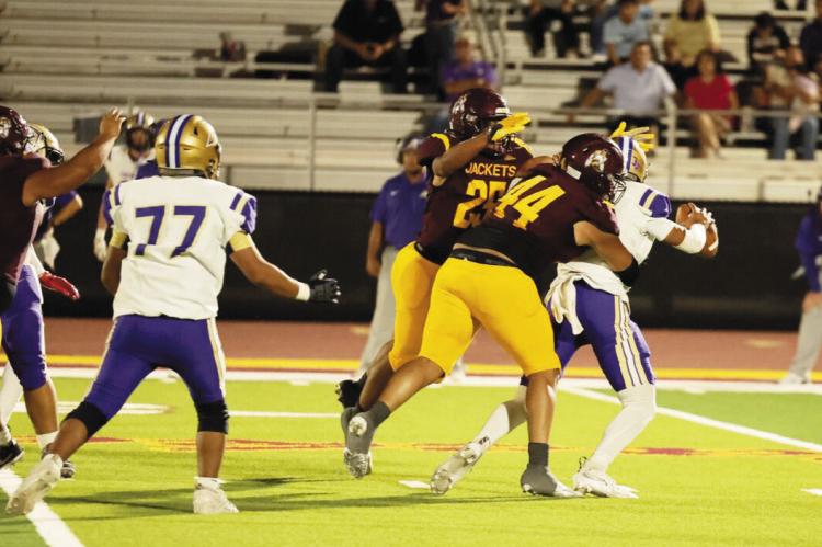 Two Kermit players contend with an Alpine player during the Buck’s matchup last Friday night. Courtesy photo
