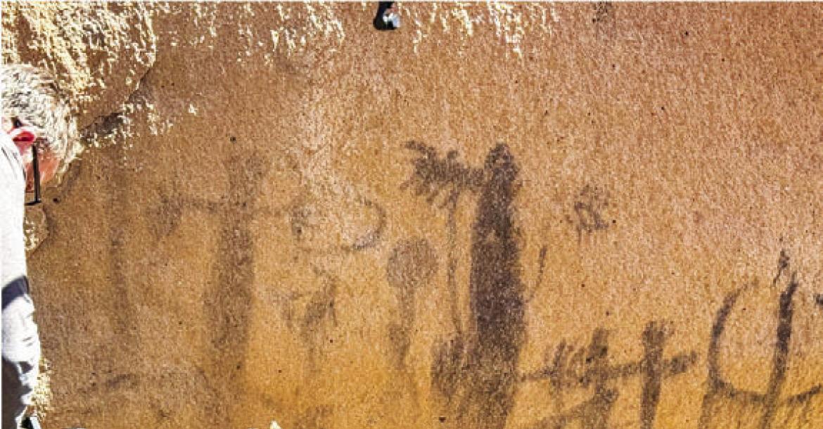 Cameraman Grant Kauffman shoots pictographs during the filming of Expedition: Tales of the Big Bend. Photo courtesy of Wild Yeti Films